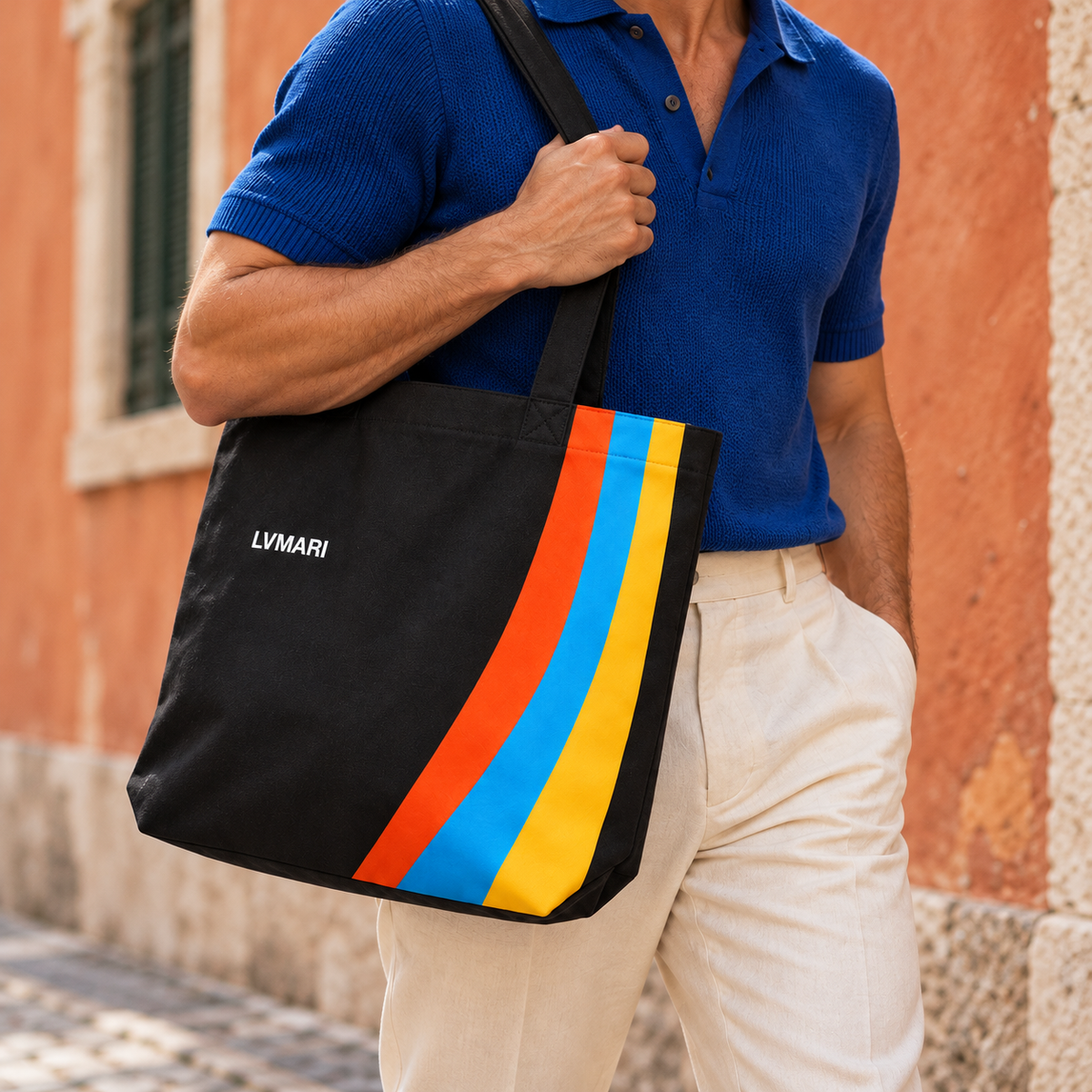 Male model wearing the black LVMARI striped tote, face cropped out